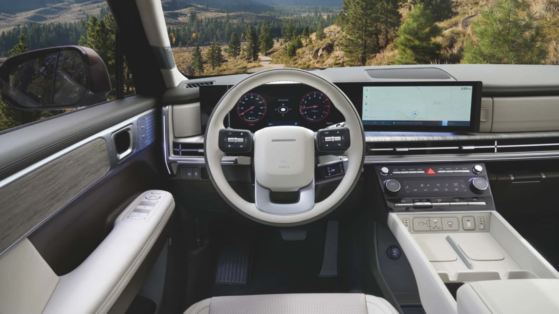 2026 Hyundai Santa Fe Hybrid interior with digital dashboard, steering wheel, and wide infotainment display.