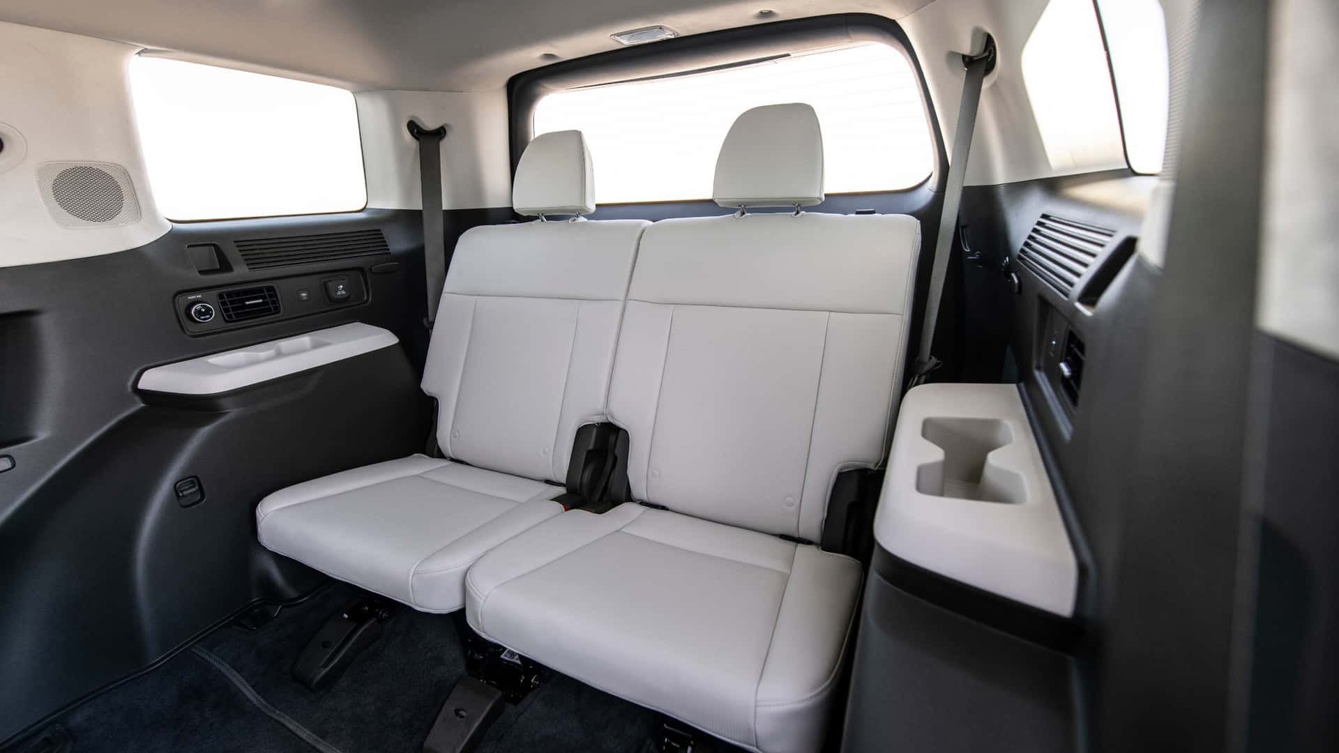 2026 Hyundai Santa Fe Hybrid third-row seating with white leather seats and rear climate controls.