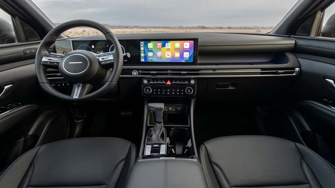 2026 Hyundai Santa Cruz interior with wide touchscreen display, digital gauges, black seats, and modern dashboard layout.