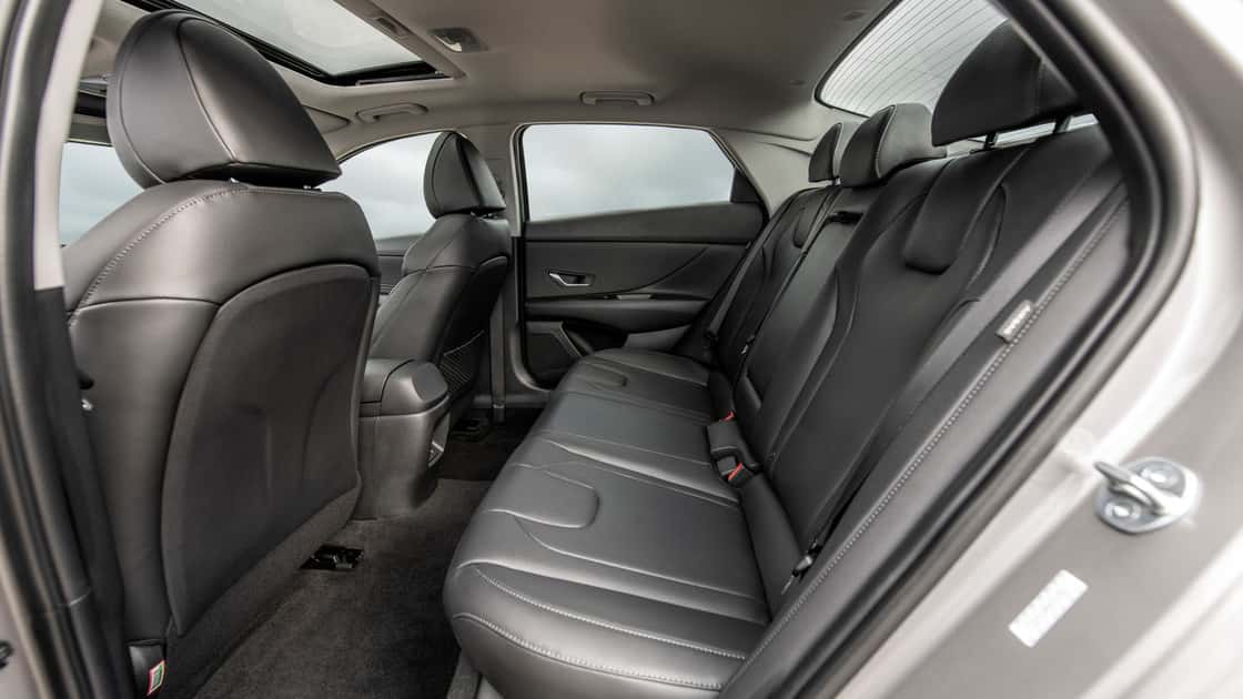 2026 Hyundai Elantra rear seating with black leather upholstery, seatbelts, rear vents, and sunroof view.