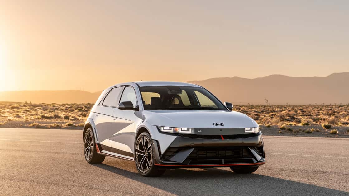 2026 Hyundai IONIQ 5 N white electric performance SUV parked at sunset with red trim and sporty wheels.