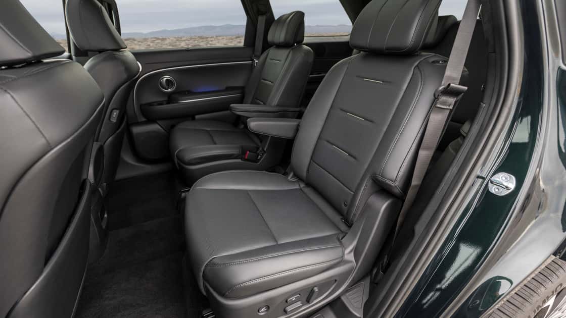 2026 Hyundai Palisade second-row seating with black leather captain’s chairs, armrests, and spacious rear cabin design.