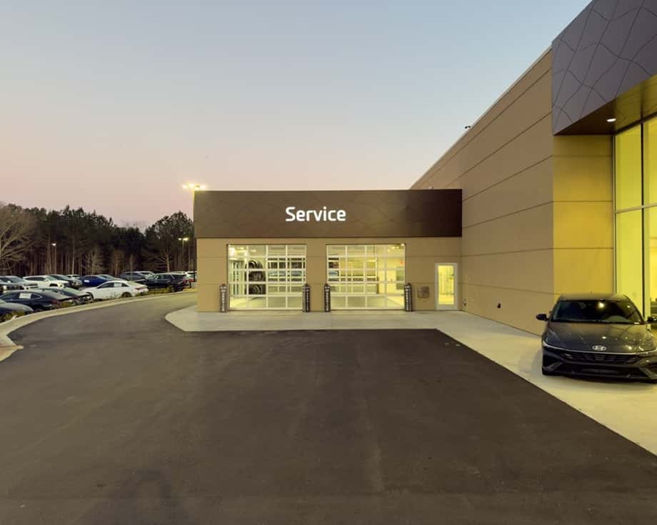 Service bays with Hyundai vehicles on lifts at ALM Hyundai Athens