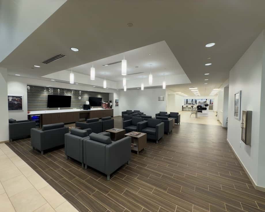 Customer waiting area with seating, TVs, and refreshments at ALM Hyundai Athens