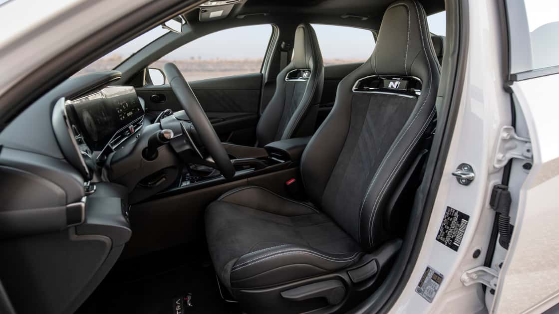 2026 Hyundai Elantra N front sport seats with N badging, black suede inserts, and contrast stitching.