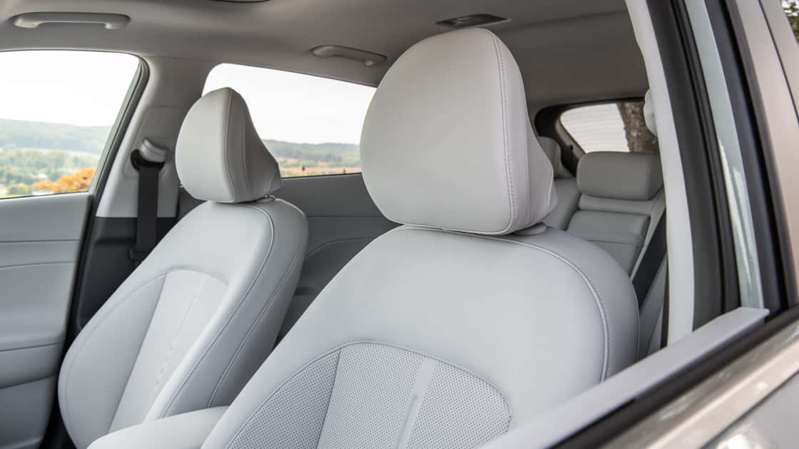 2026 Hyundai Kona front seats with light gray upholstery, spacious cabin layout, and clean interior styling.