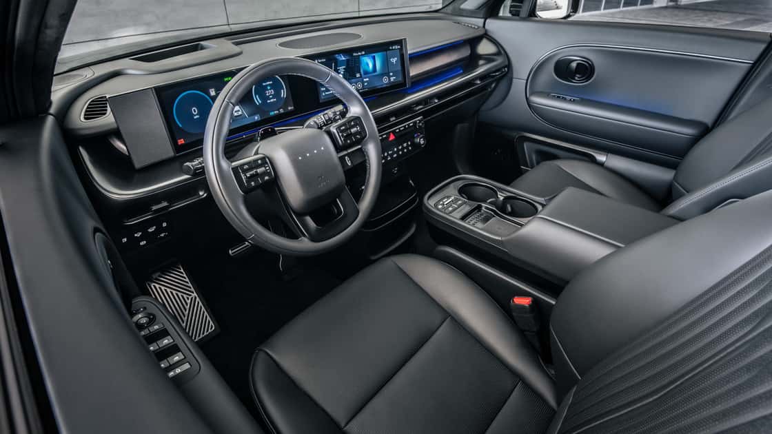 2027 Hyundai IONIQ 9 interior with black seats, digital dashboard, and wide center console.