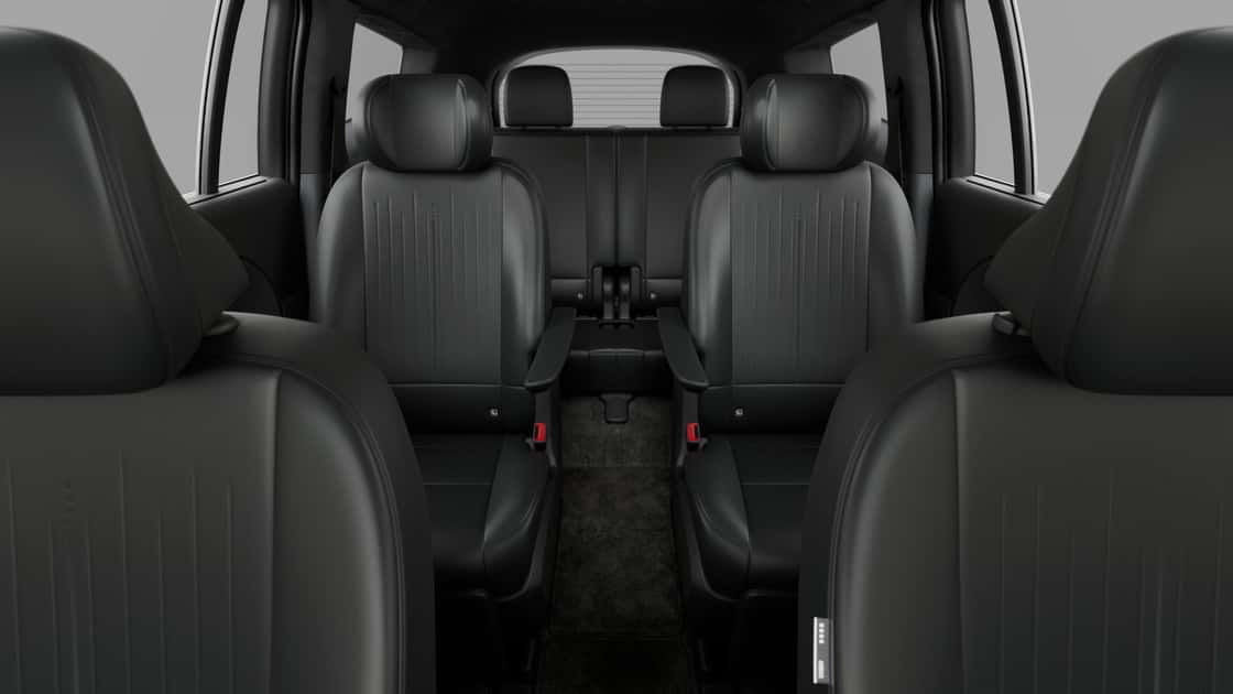 2027 Hyundai IONIQ 9 cabin showing three rows of black seating with captain’s chairs and spacious layout.