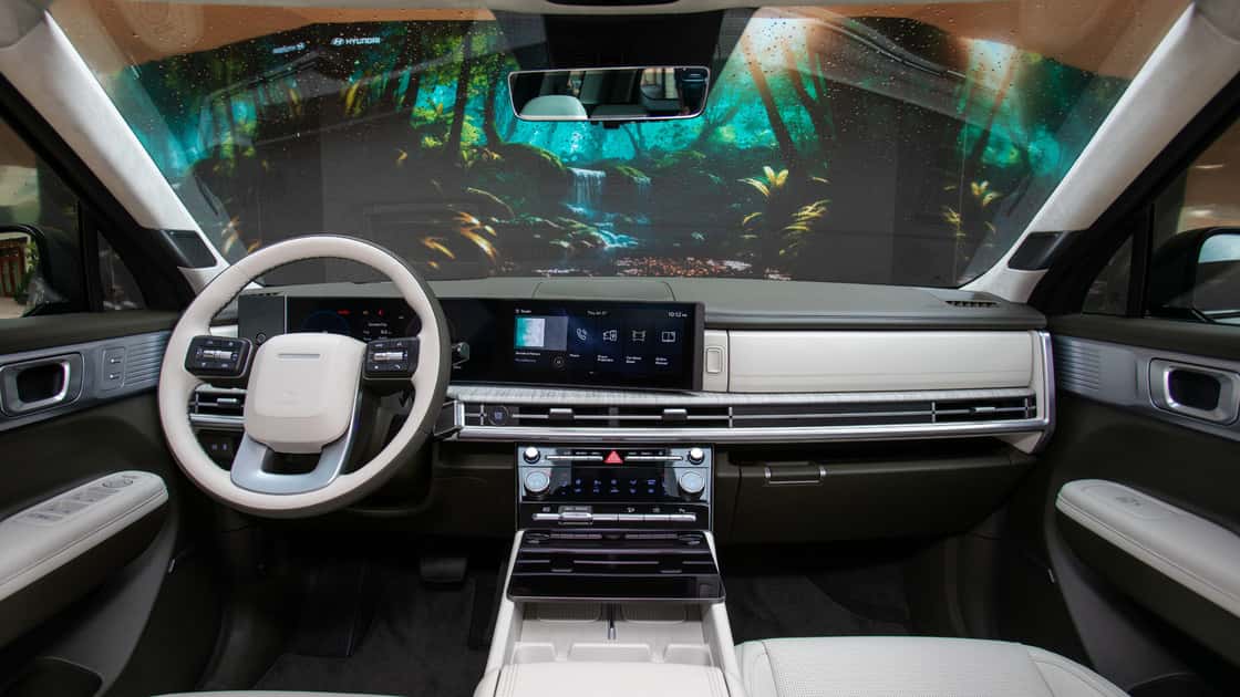 2027 Hyundai Santa Fe interior with light dashboard, digital display, and scenic windshield projection.