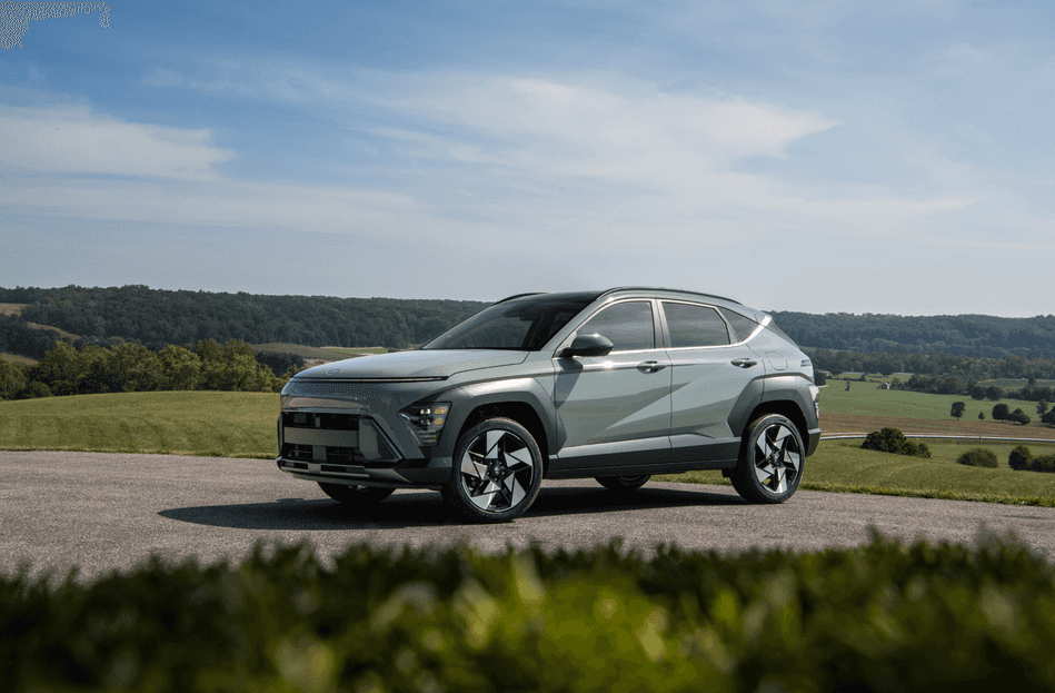 2025 Hyundai Kona parked on a scenic overlook, showcasing its bold grille and sharp design