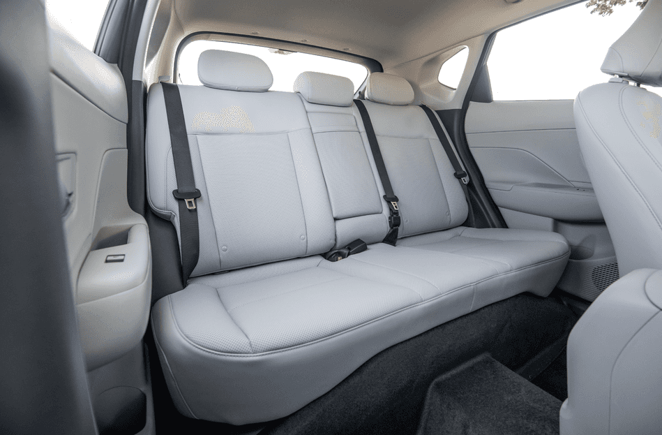 Spacious rear seating of the 2025 Hyundai Kona with light gray upholstery and safety belts