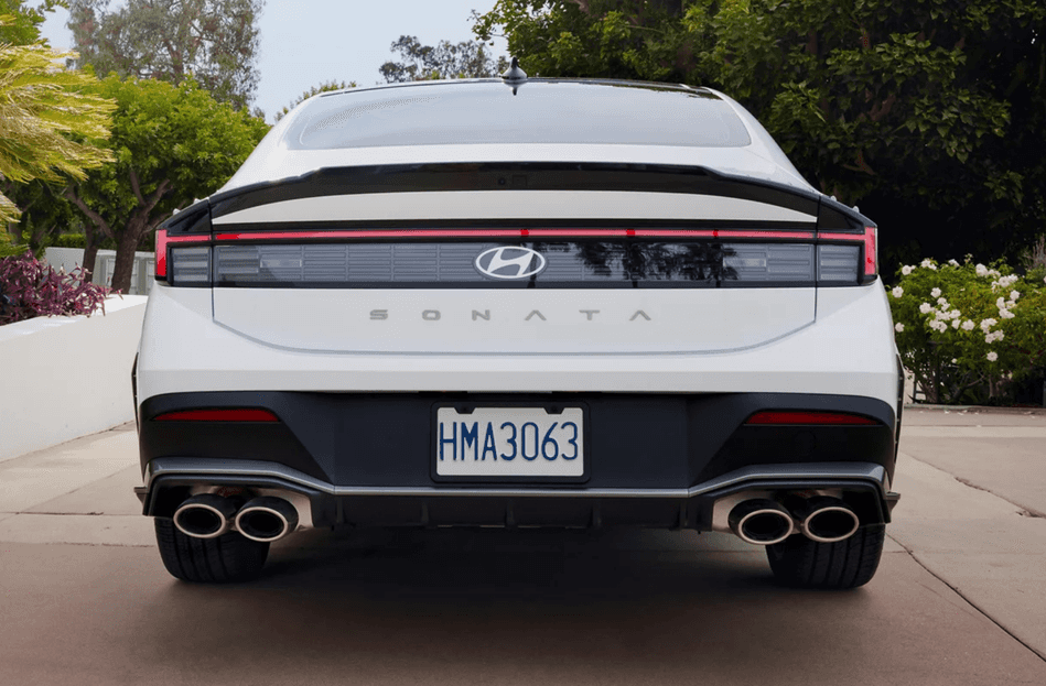 Rear view of 2025 Hyundai Sonata showing quad exhaust and full-width tail light