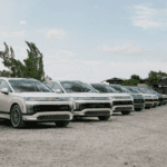 Lineup of 2026 Hyundai IONIQ 9 electric SUVs parked at an outdoor Hyundai event location.