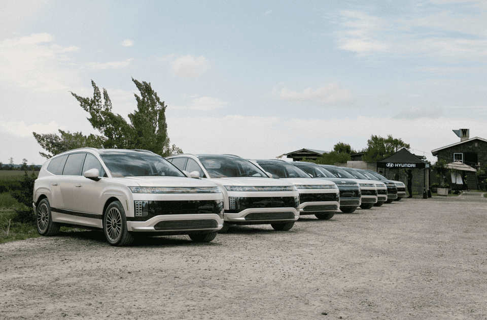 Lineup of 2026 Hyundai IONIQ 9 electric SUVs parked at an outdoor Hyundai event location.