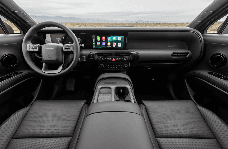 Dashboard and cockpit view of 2026 Hyundai Palisade XRT with touchscreen and black interior.