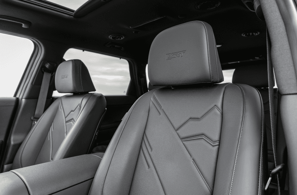 Close-up of 2026 Hyundai Palisade XRT front leather seats with embossed stitching and logo.