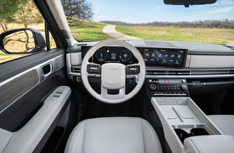 Front cabin of 2025 Hyundai Santa Fe featuring dual-display dash and modern infotainment layout.