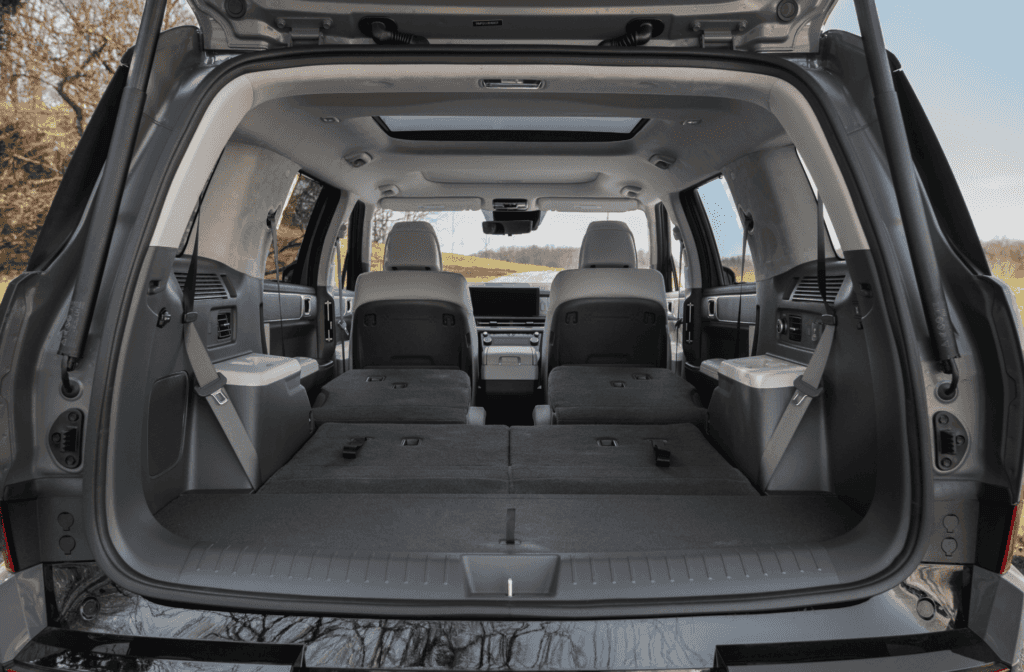 Rear cargo view of the 2026 Hyundai Santa Fe with second and third-row seats folded flat for maximum storage capacity.
