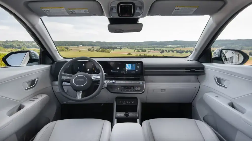 Interior dashboard of 2026 Hyundai Kona featuring digital displays and infotainment touchscreen.