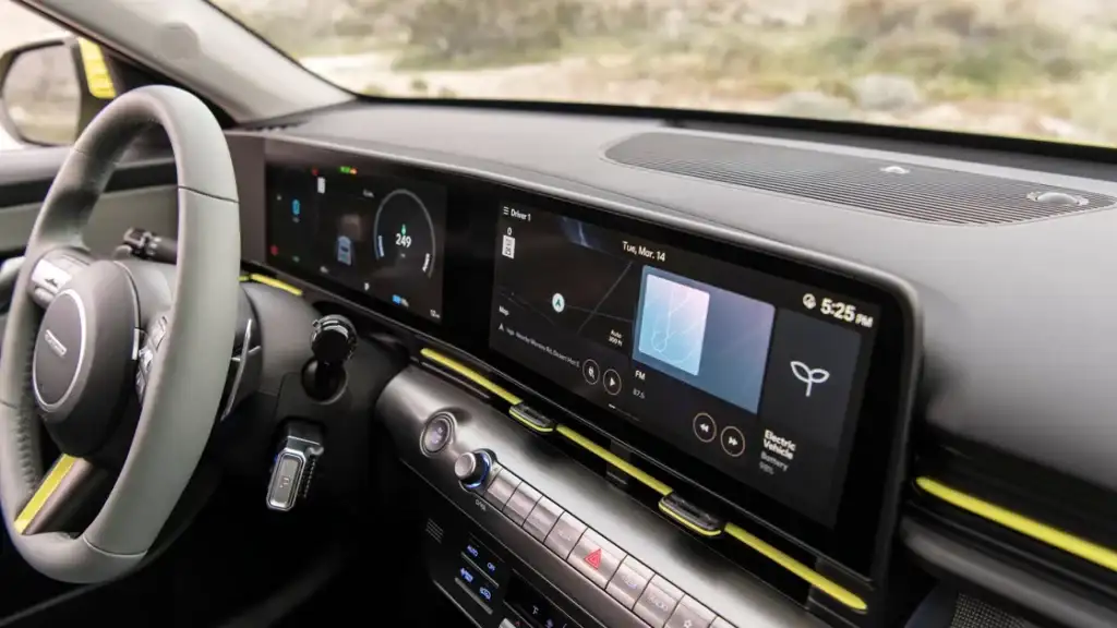 Driver cockpit of 2026 Hyundai Kona Electric featuring dual digital displays and modern controls.