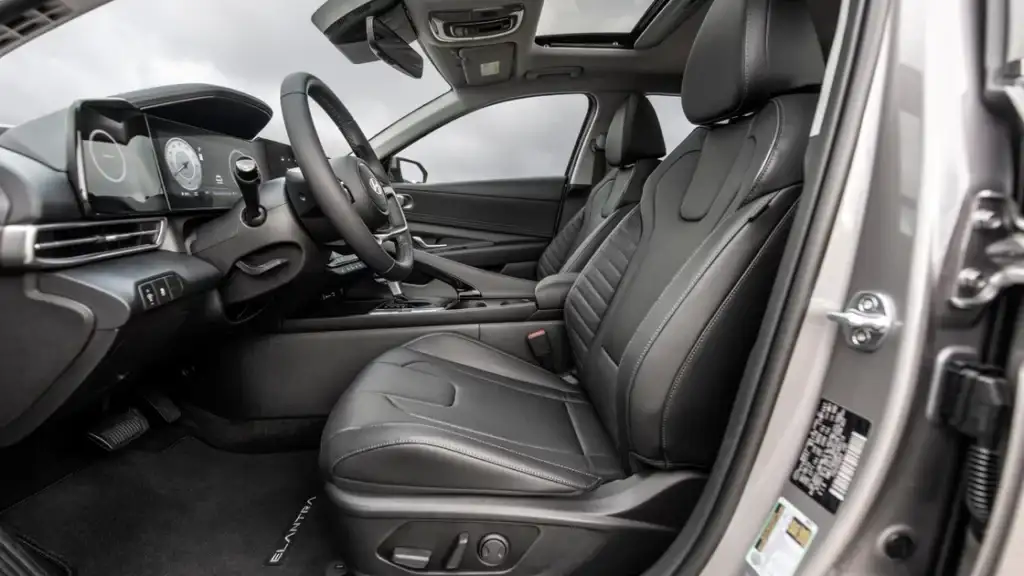 Interior view of the 2026 Hyundai Elantra showing the steering wheel, digital gauges, and touchscreen.