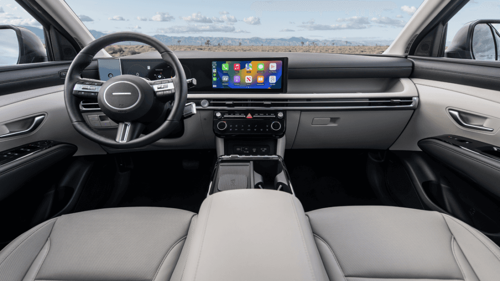 2026 Hyundai Tucson interior dashboard with widescreen display and modern controls.