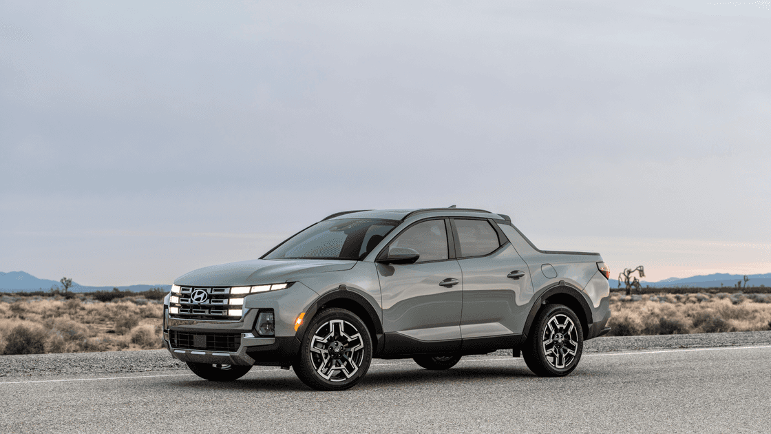 2026 Hyundai Santa Cruz exterior front three quarter view parked on desert roadway.