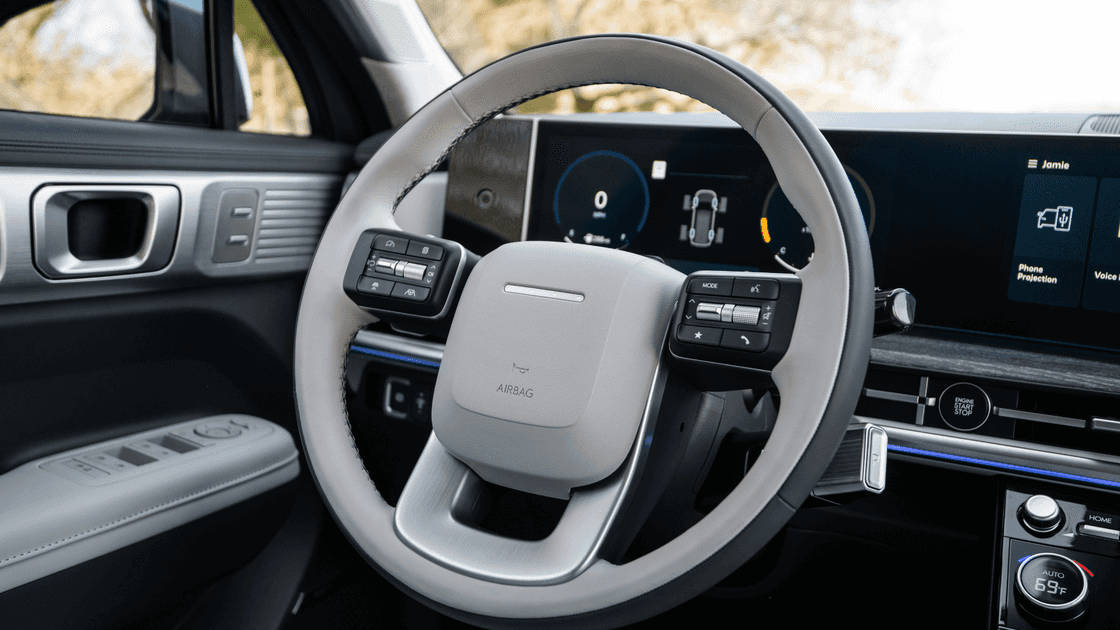 2026 Hyundai Santa Fe s interior steering wheel and digital instrument display.