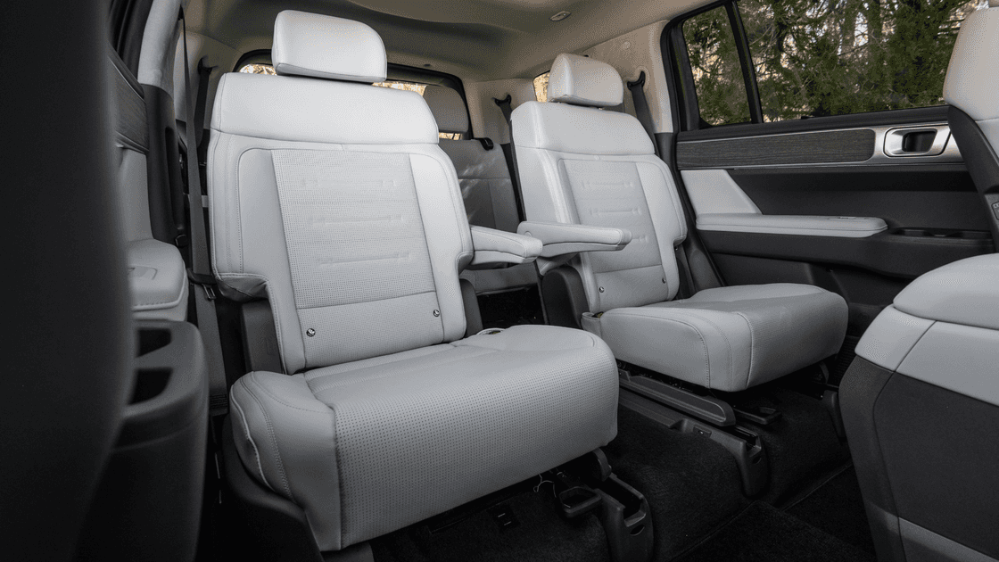 2026 Hyundai Santa Fe second row seating with light upholstery and captain chairs.