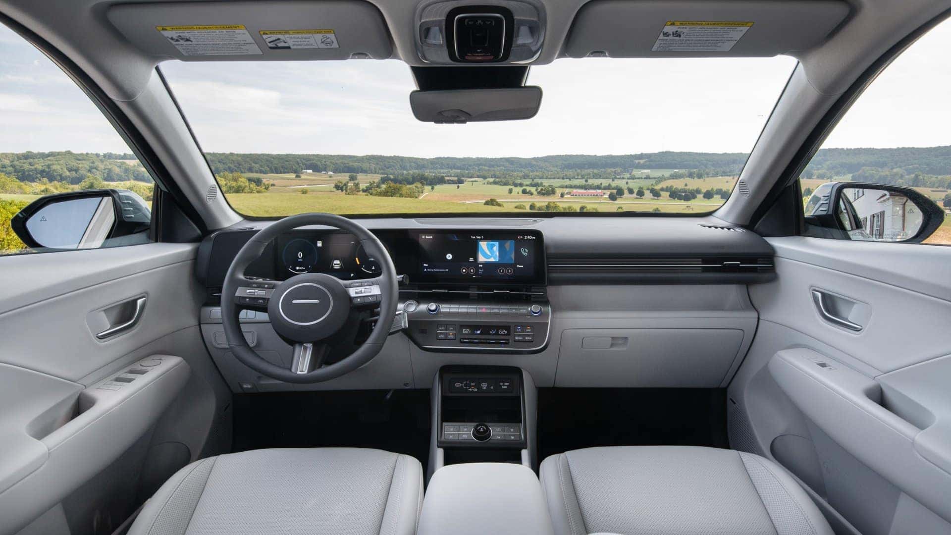 2026 Hyundai Kona front interior view featuring digital instrument cluster, infotainment screen, and center console.