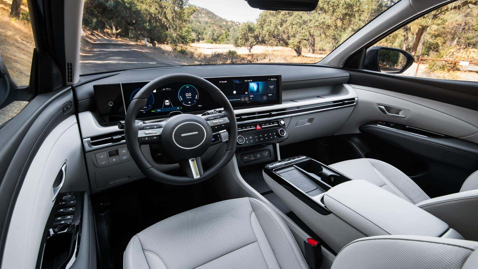 2026 Hyundai Tucson Hybrid interior dashboard with dual digital displays and modern center console.