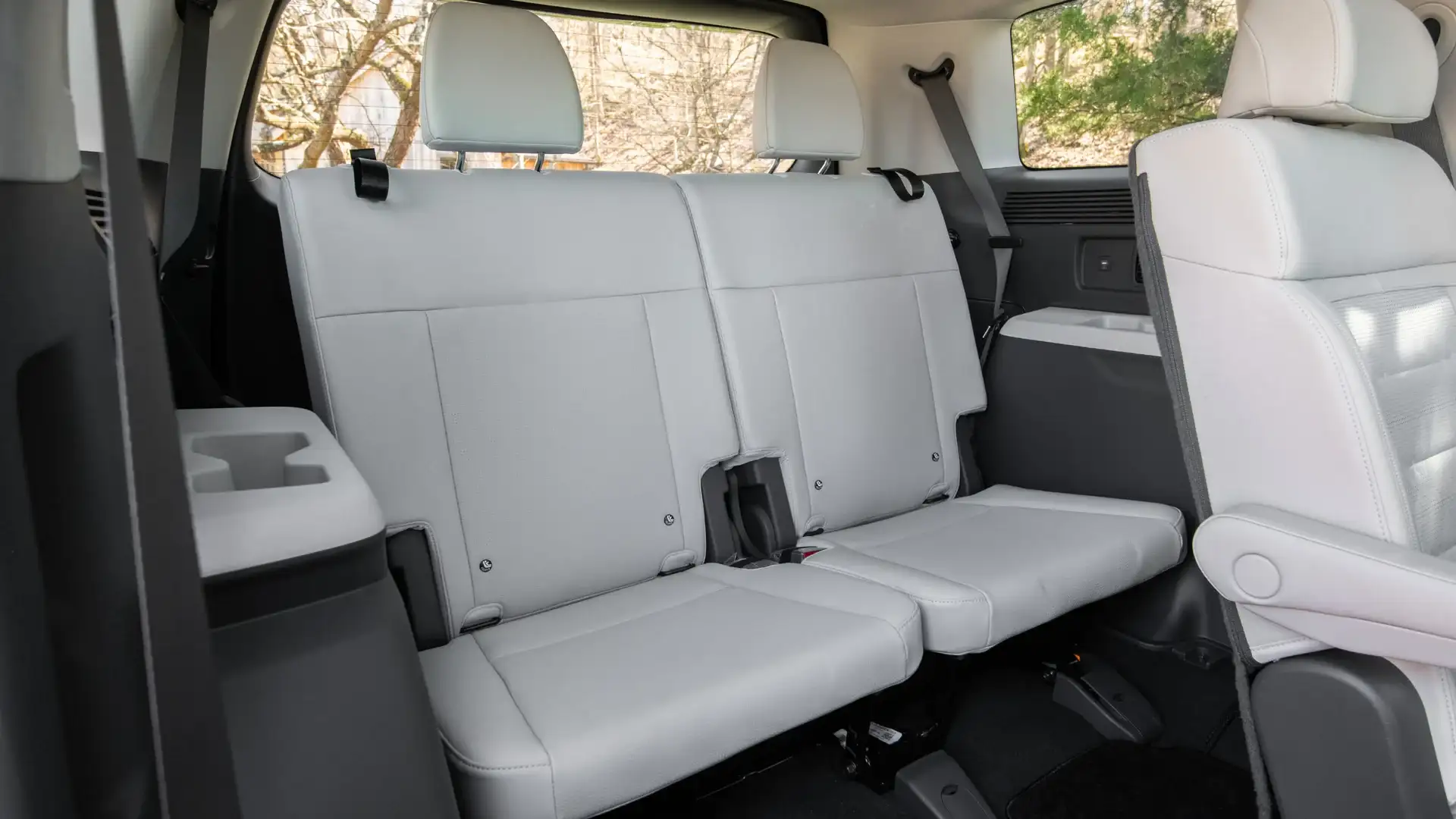 2026 Hyundai Santa Fe third-row seating with white upholstery, headrests, and rear cabin space.
