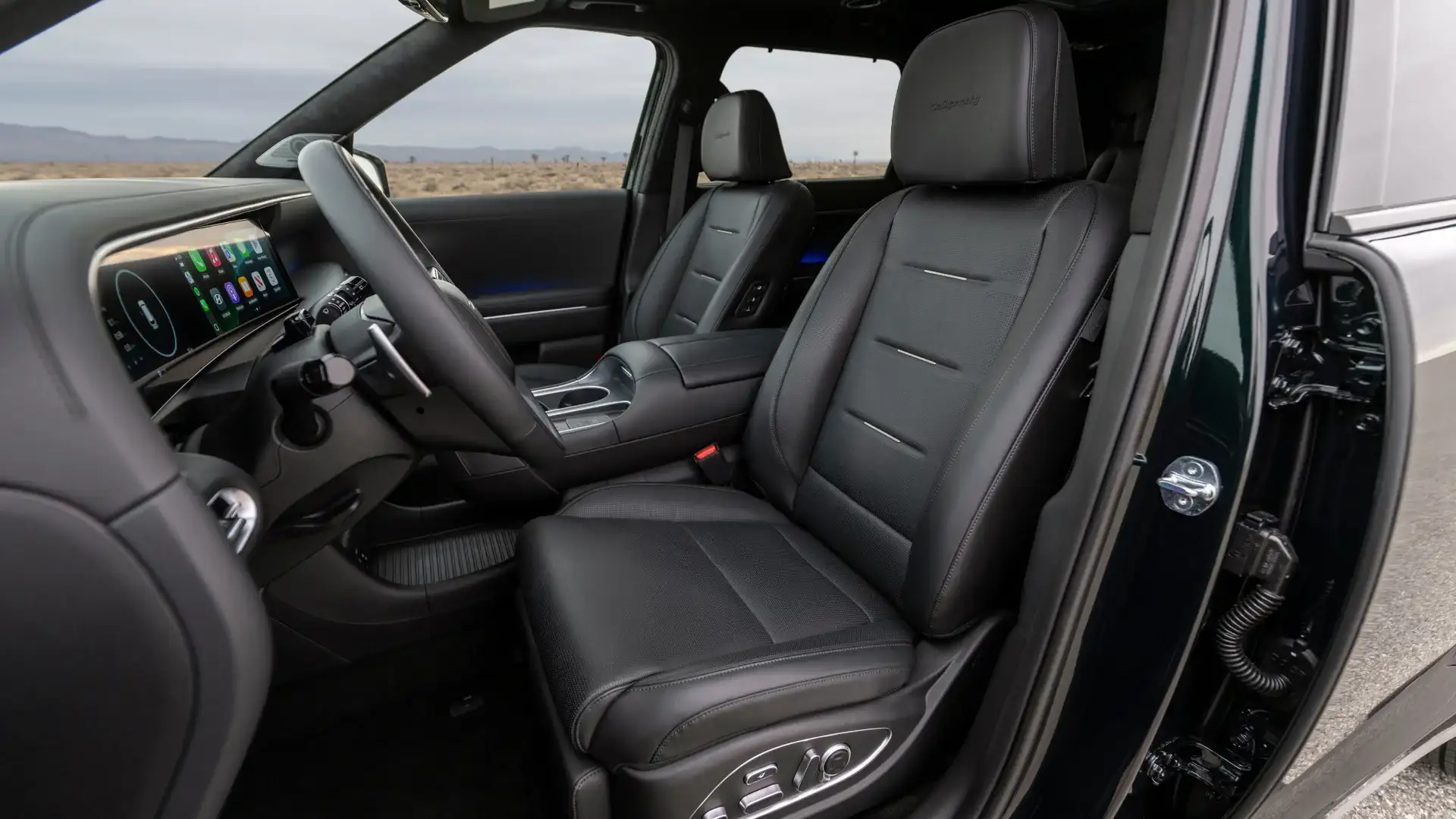 2026 Hyundai Palisade front cabin with black leather seats, touchscreen display, and center console.
