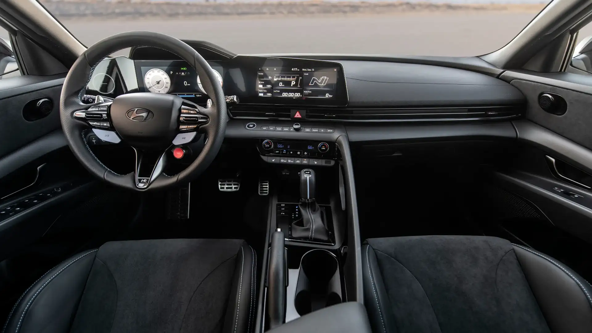 2026 Hyundai Elantra N black cockpit with N digital display, sport steering wheel, and shifter.