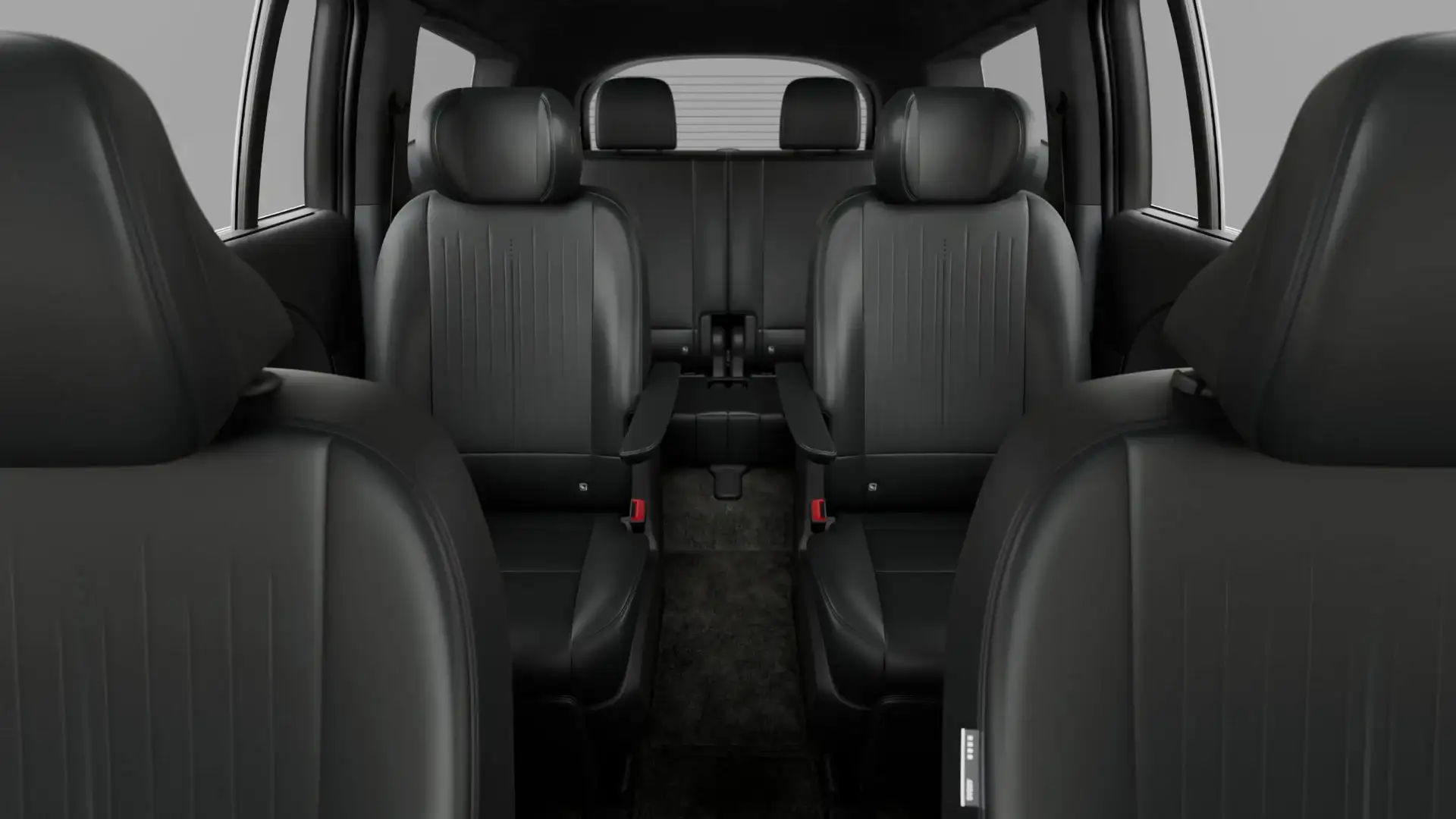 2027 Hyundai IONIQ 9 cabin with black second-row captain’s chairs and rear passenger seating.