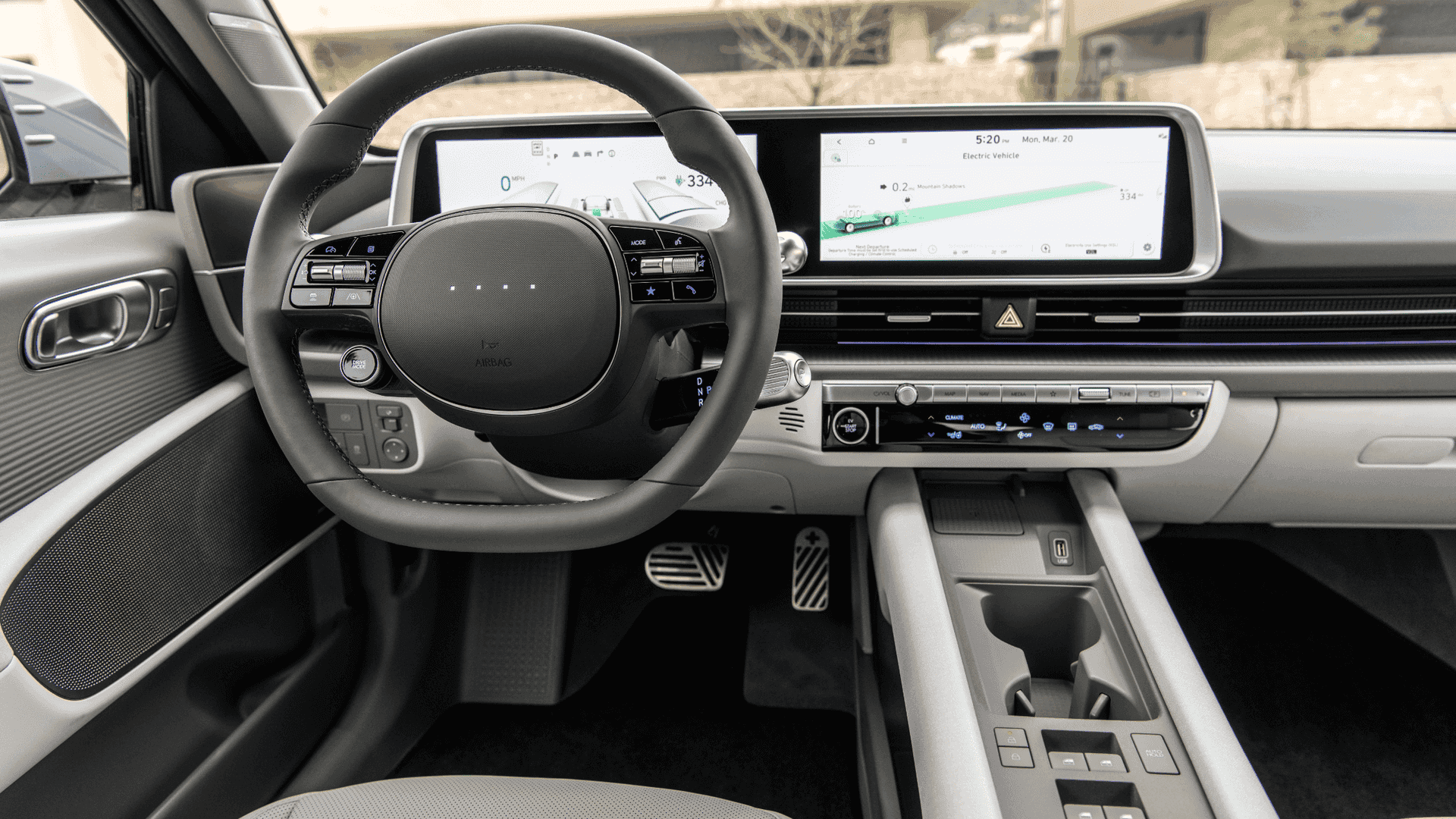 Close-up of center console controls and cupholders in the 2025 Hyundai IONIQ 6 interior