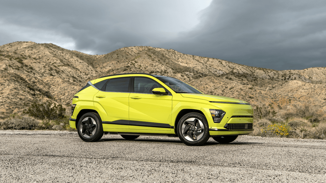Driver-focused interior of the 2025 Hyundai Kona Electric featuring digital displays and modern dashboard layout.