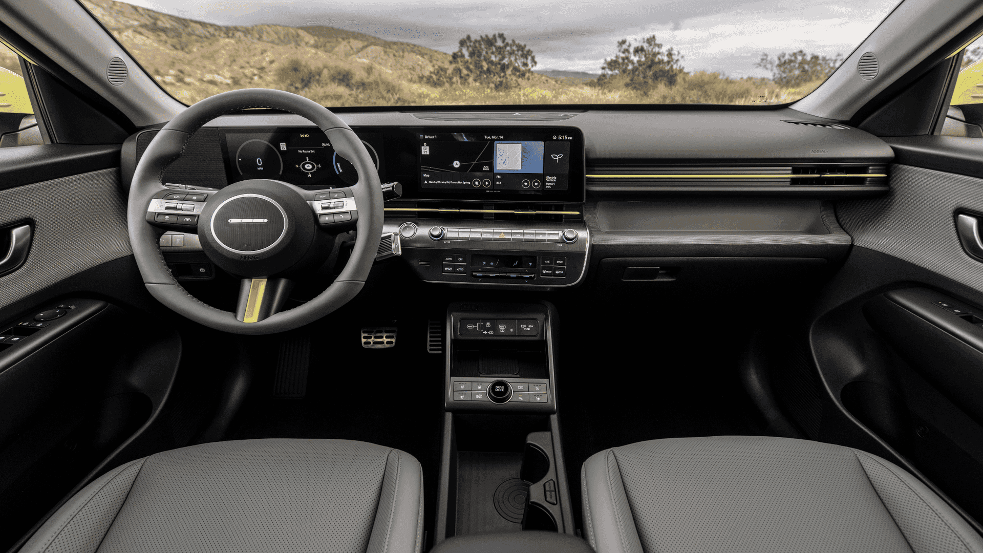 Interior cockpit view of the 2025 Hyundai Kona Electric featuring dual digital displays