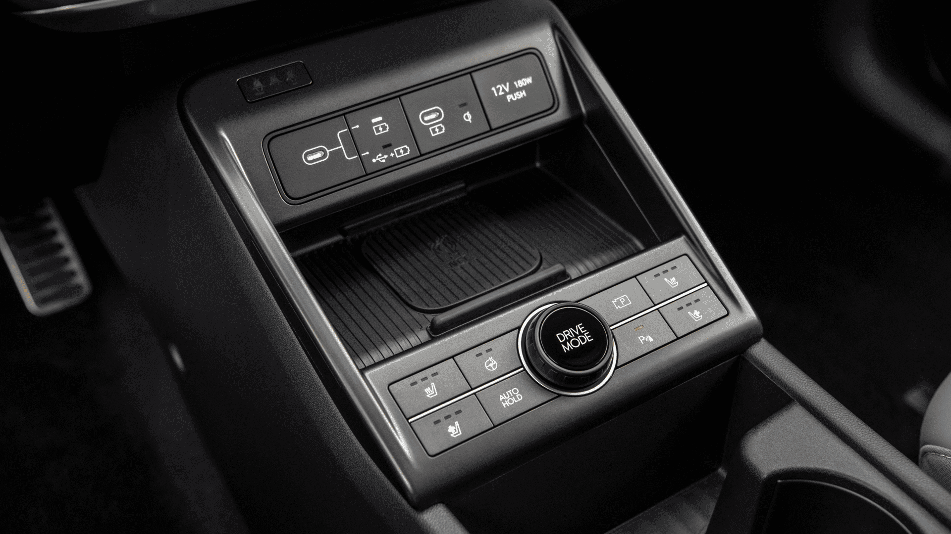 2025 Hyundai Kona Electric center console with wireless charging pad and drive mode dial