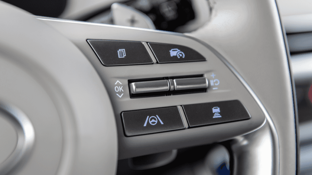 Steering wheel buttons in 2025 Hyundai Palisade showing cruise and lane assist controls.