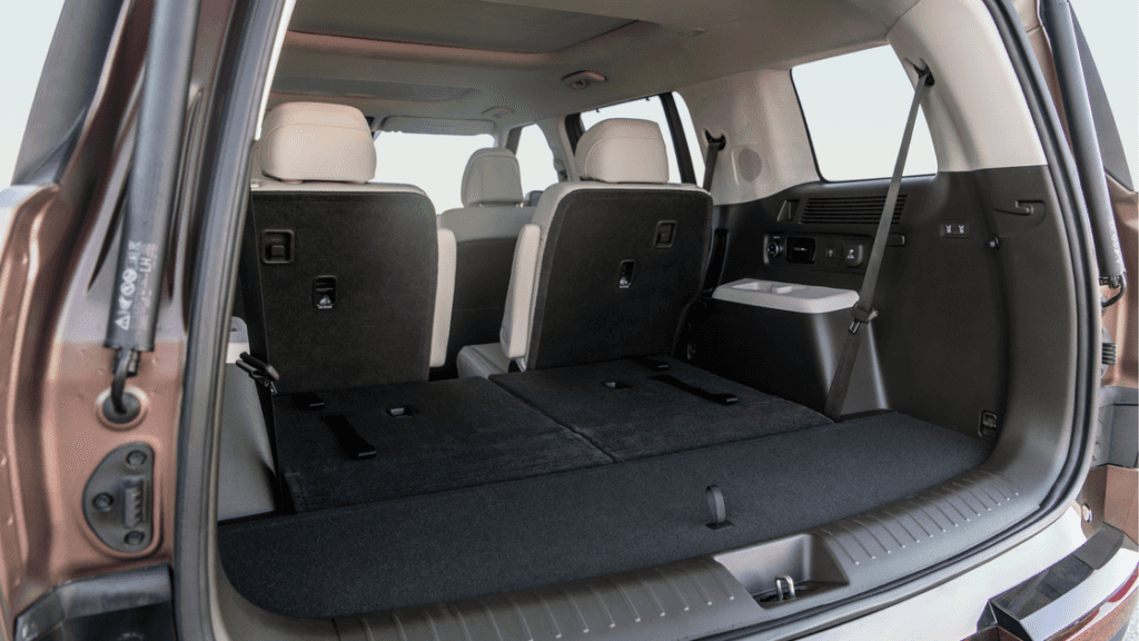 Rear cargo area of the 2025 Hyundai Santa Fe Hybrid with third-row seats partially folded down.