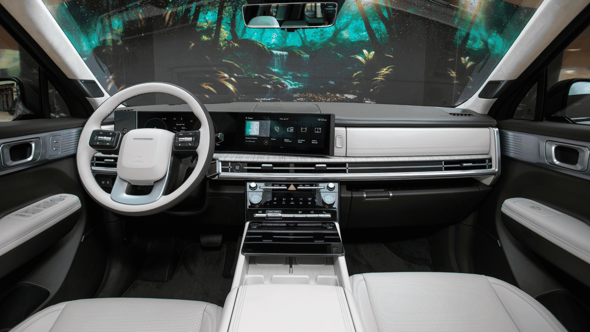 Interior of 2025 Hyundai Santa Fe Hybrid showing two-tone steering and widescreen display