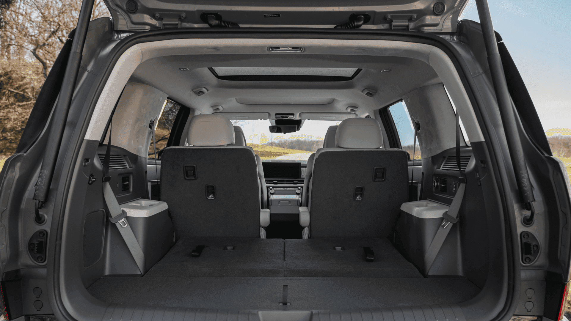 Rear cargo view of 2025 Hyundai Santa Fe Hybrid with third row folded and panoramic roof