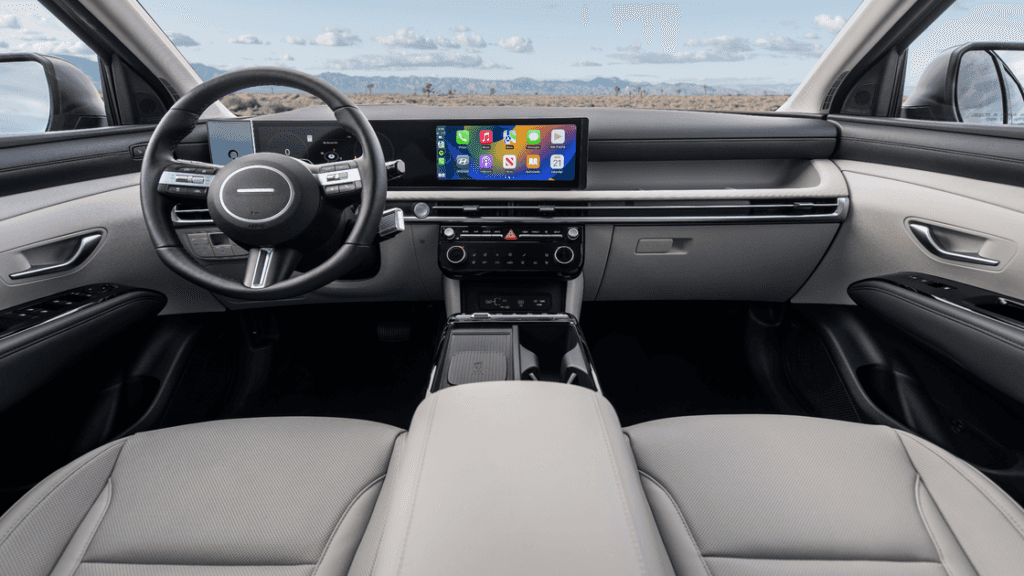 2025 Hyundai Tucson interior featuring touchscreen display with Apple CarPlay and sleek dashboard.