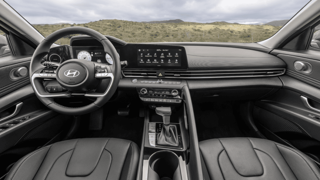 Interior view of the 2025 Hyundai Elantra showcasing the dashboard, steering wheel, and center display.