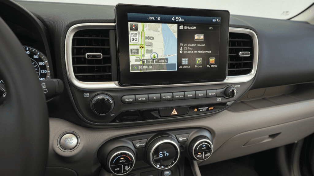 Close-up of the 2025 Hyundai Venue's touchscreen with navigation, SiriusXM, and climate controls.