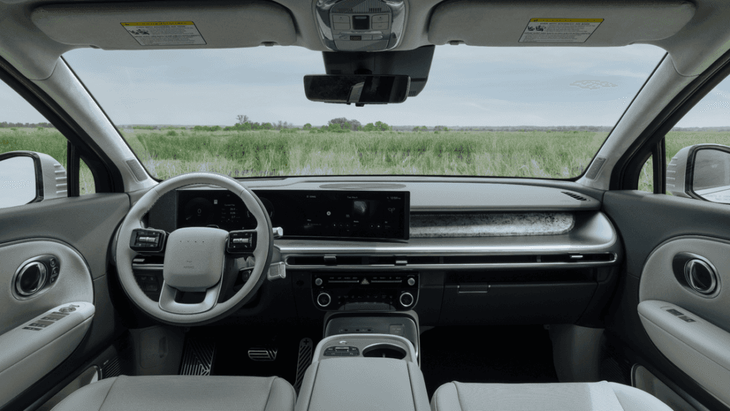 2026 Hyundai IONIQ 9 interior dashboard with digital display and panoramic road view.