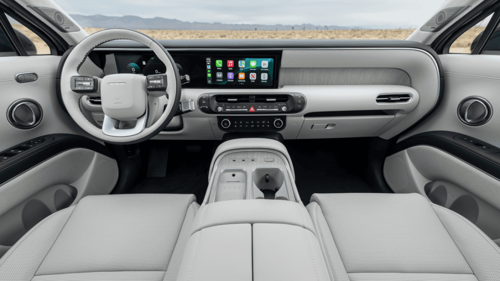 Front interior view of the 2026 Hyundai Palisade featuring a dual-display dashboard and premium trim.