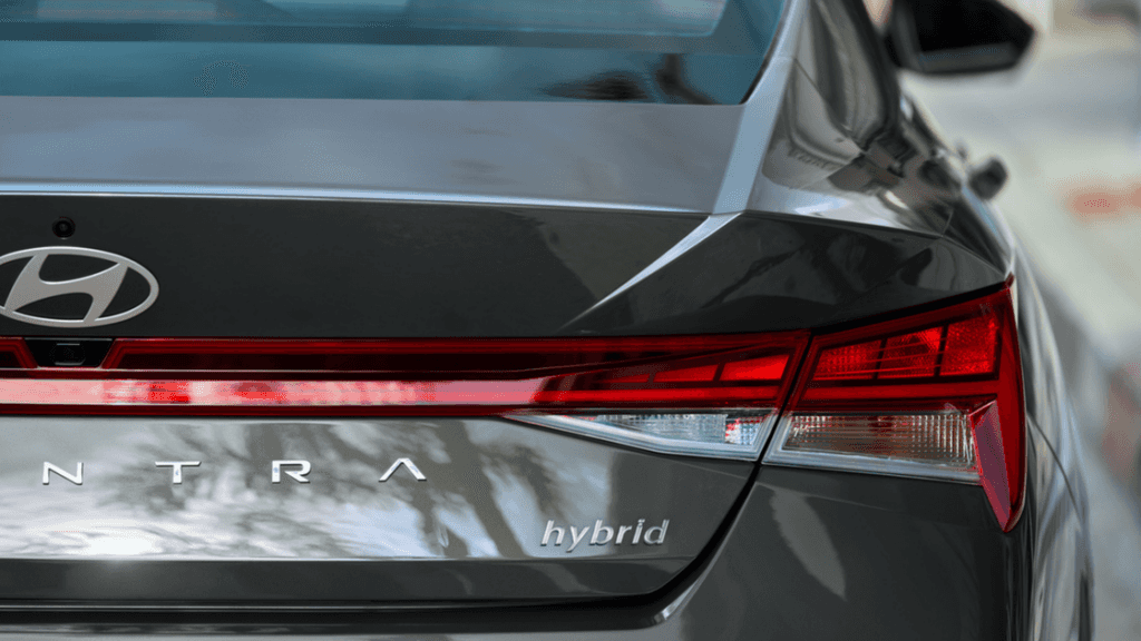 Rear badge and taillight close-up of the 2025 Hyundai Elantra Hybrid in gray finish.