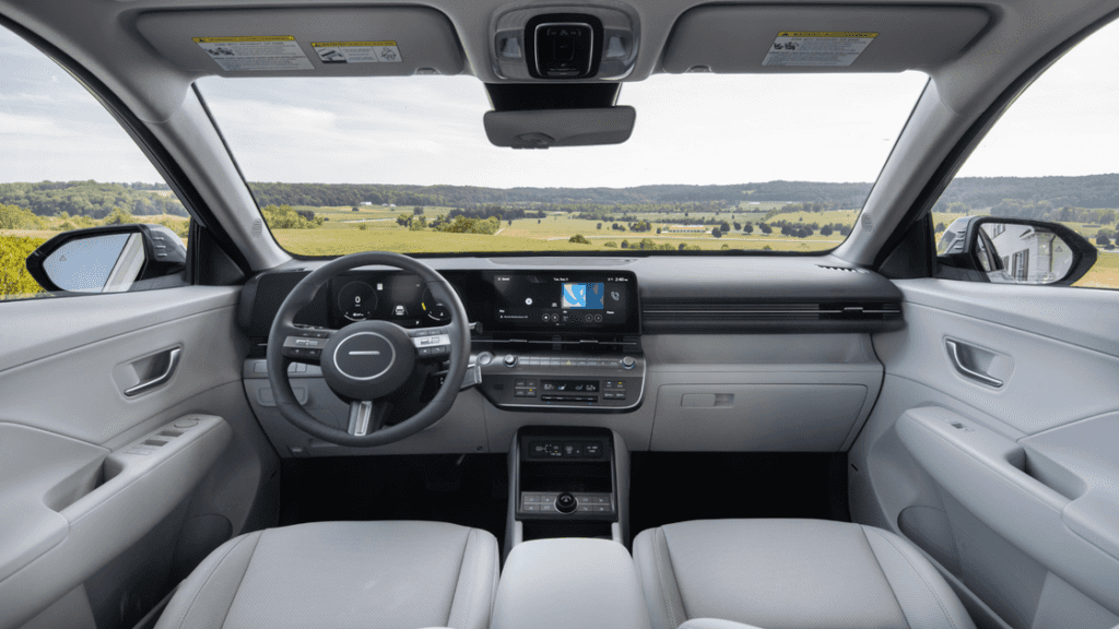 Front cabin view of the 2025 Hyundai Kona featuring digital driver display and infotainment screen.